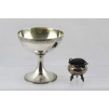 A SILVER CAULDRON DESIGN PIN CUSHION, with swing handle, raised on three turned supports, London