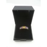 A 9CT. GOLD DRESS RING, set with sapphires, rubies, citrine and diamonds, size N easy