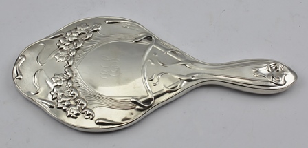 DIMIER BROS AN EDWARDIAN SILVER LADY'S HAND MIRROR, fancy shape having pressed Art Nouveau floral