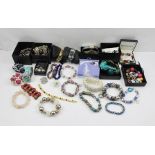 A QUANTITY OF COSTUME JEWELLERY, includes hardstone bracelet etc.