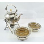 A SILVER PLATED SPIRIT KETTLE ON STAND and a PAIR OF GEORGIAN DESIGN BOTTLE COASTERS