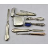 A SELECTION OF SILVER ACCOUTREMENTS to include; a vesta case, mother of pearl handled folding