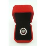 AN 18CT. WHITE GOLD LARGE RUBYLITE AND DIAMOND DRESS RING, size O