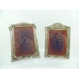 TWO HALLMARKED SILVER PRESSED PHOTOGRAPH FRAMES, on easel action supports, 18cm tallest