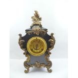 A ROCOCO DESIGN BLACK AND GILT CASED "ANSONIA" MANTEL TIMEPIECE, 47cm high (with pendulum and key)
