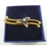 A VICTORIAN 9CT. GOLD BAR BROOCH set with opal and sapphires, bears Chester hallmarks