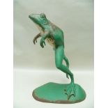 AN EARLY 20TH CENTURY CAST IRON LEAPING FROG FOUNTAIN on plinth base. 68cm high.