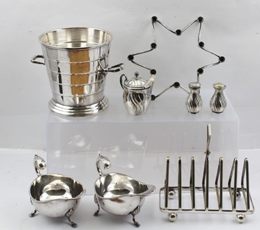 A DANISH SILVER PLATED TAPER STICK HOLDER of star form, together with a silver plated ICE BUCKET,
