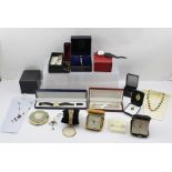 A SELECTION OF COSTUME JEWELLERY to include some marked M & S, two folding bedside alarm clocks,
