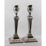 W.G KEIGHT A PAIR OF EDWARDIAN SILVER CANDLESTICKS of Adam design, urn form sconces with removable