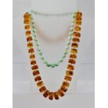 A JADE BEAD NECKLACE, and an AMBER EFFECT NECKLACE