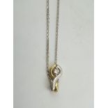 A 14CT. GOLD AND SOLITAIRE DIAMOND PENDANT, with a 9CT. CHAIN