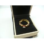 AN 18CT. GOLD ENAMEL AND DIAMOND SET "HEARTS" RING, size J 1/2