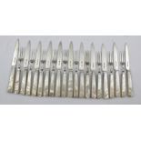 R.F. MOSLEY & CO. A PART SILVER BLADED DESSERT AND FISH EATING SET with mother of pearl handles,