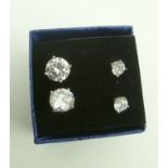 TWO PAIRS OF SILVER CUBIC ZIRCONIA STUD EARRINGS (half carat and two carat)