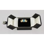 AN 18CT GOLD RING set with a central emerald cut blue topaz flanked by two citrines, size Q 1/2