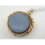 A VICTORIAN 18CT. GOLD SWIVEL FOB/LOCKET set with hardstones