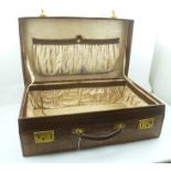 A PROBABLY 1920's CROCODILE STITCHED LEATHER LUGGAGE CASE, with brass fittings and initialled J.