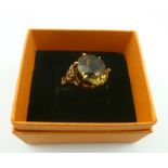 A LADY'S 9CT. GOLD DRESS RING, set with single large stone, size "P"
