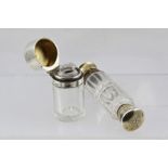 A LATE VICTORIAN/EDWARDIAN SILVER GILT AND CLEAR LEAD CRYSTAL DOUBLE ENDED SCENT BOTTLE,