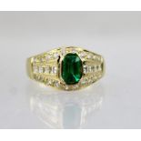 AN 18CT GOLD EMERALD AND DIAMOND DRESS RING, size L 1/2