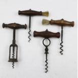 TWO EARLY 20TH CENTURY CORKSCREWS with dusting brushes to the handles, together with TWO OTHER