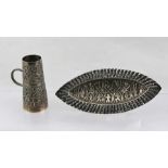 TWO PIECES OF TYPICALLY EMBOSSED INDIAN SILVER COLOURED METAL, to include lozenge shaped dish,