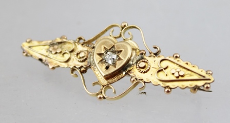 A VICTORIAN GOLD BAR BROOCH set central diamond within a heart and scrolled frame - Image 3 of 3