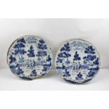 A PAIR OF 18TH CENTURY ENGLISH TIN GLAZED EARTHENWARE CHARGERS each painted in the Dutch manner with