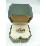 T & S A 9CT GOLD VICTORIAN STYLE GARNET DRESS RING, set with five graduating stones interspersed