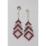 A PAIR OF 18CT ART DECO STYLE RUBY AND DIAMOND DROP EARRINGS with alternating tiers of rubies and