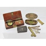 A LATE 19TH CENTURY FRENCH MAHOGANY CASED SET OF MINIATURE STEEL BALANCE SCALES, with brass pans and