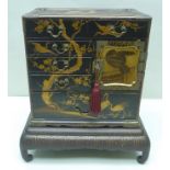 A PROBABLY 19TH CENTURY ORIENTAL LACQUER WORK TABLE CABINET, having multi-drawer frontage, some