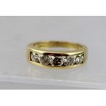 AN 18CT GOLD HALF ETERNITY RING set with five diamonds, size I 1/2