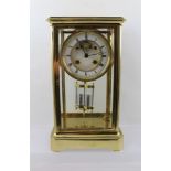 A LATE 19TH CENTURY FRENCH FOUR-GLASS CLOCK, the plain brass frame with bevel cut glass, the white