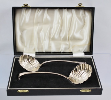 A PAIR OF GEORGIAN SILVER SAUCE LADLES with scallop form bowls and scroll terminal ends, London,