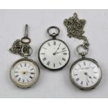 THREE LATE VICTORIAN LADY'S FOB WATCHES, two are in decoratively chased white metal cases, the other