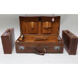 AN EARLY 20TH CENTURY LEATHER DRESSING CASE, pig skin lined with fittings, some silver mountings and