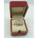 AN 18CT GOLD AND DIAMOND DRESS RING, having fifty-four small diamonds set in a wide band, stamped "