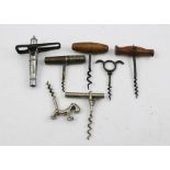 A COLLECTION OF SEVEN VARIOUS CORKSCREWS, includes novelty ones, one in the form of a stylised