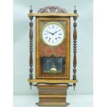 A LATE 20TH CENTURY FANCY INLAID MAHOGANY CASED WALL CLOCK with applied crest and turned pilaster