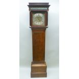 AN EARLY 19TH CENTURY OAK LONGCASE, having 30-hour movement, brass face with silvered chapter