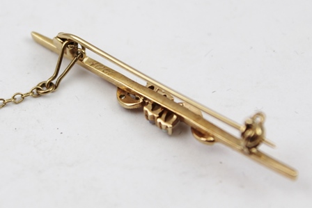 A GOLD BAR BROOCH set three central opals with diamonds, pin mount and safety chain - Image 2 of 2