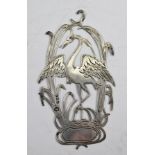 AN EDWARDIAN SILVER MOUNT, probably from a book or casket, pierced and chased with a stork amongst