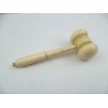 A LATE 19TH CENTURY IVORY GAVEL having ring turned head and knop tip to handle, 12.5cm long