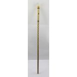 AN EARLY 19TH CENTURY TURNED WHALE BONE WALKING CANE, having spiral twist shaft with marine ivory