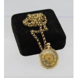 A CONTINENTAL 14K CASED LADY'S FOB WATCH, decoratively chased, having gilded dial with Roman