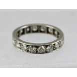 A DIAMOND SET PLATINUM ETERNITY RING, set with eighteen sizable stones