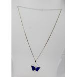 A SILVER AND ENAMEL PENDANT AND CHAIN, the pendant in the form of a butterfly with azure blue