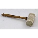 A MASONIC GAVEL with stone head and olive wood handle, engraved inscription "Presented to the Howe